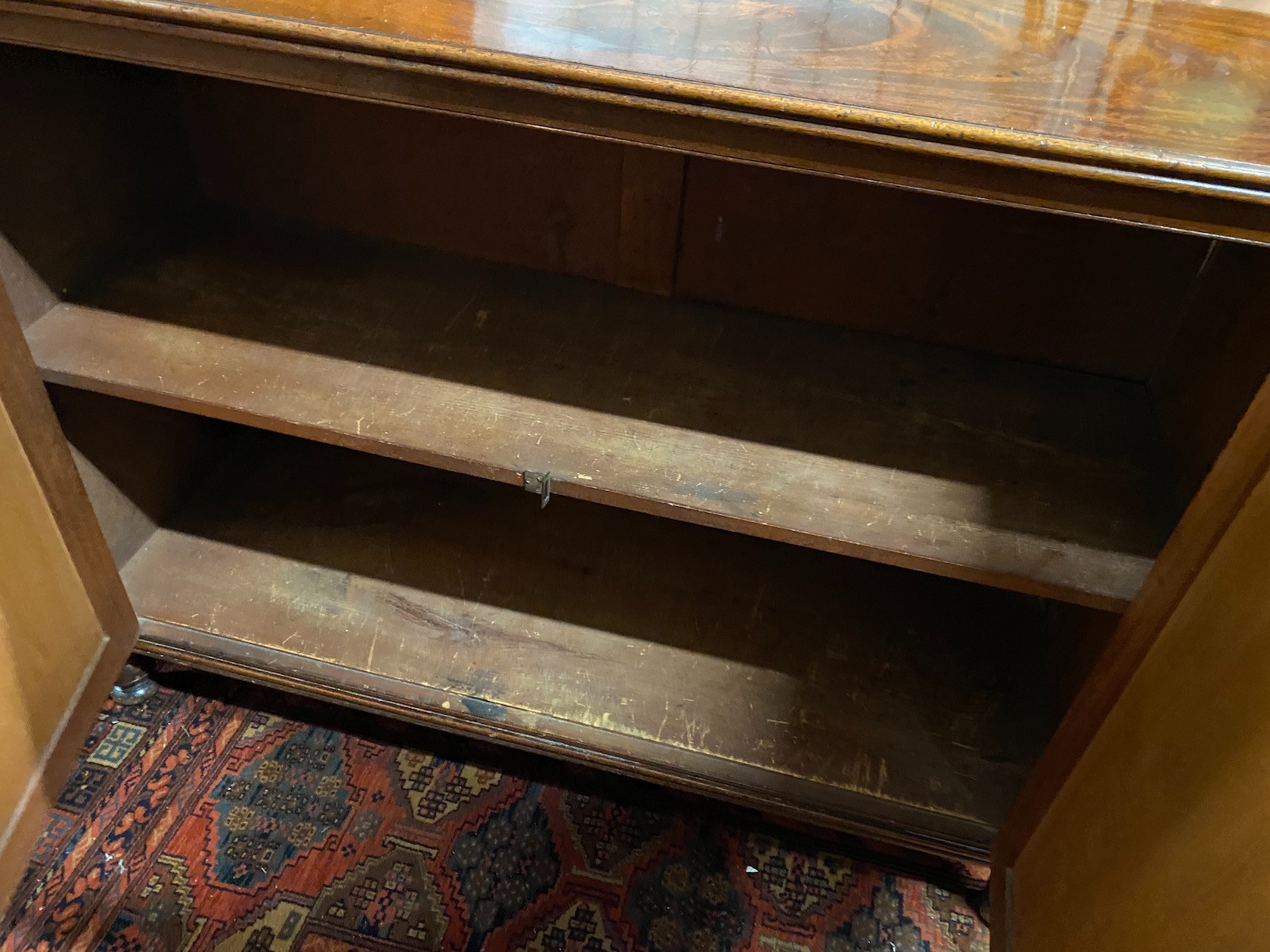 An early VIctorian mahogany two door side cabinet, width 124cm, depth 44cm, height 92cm